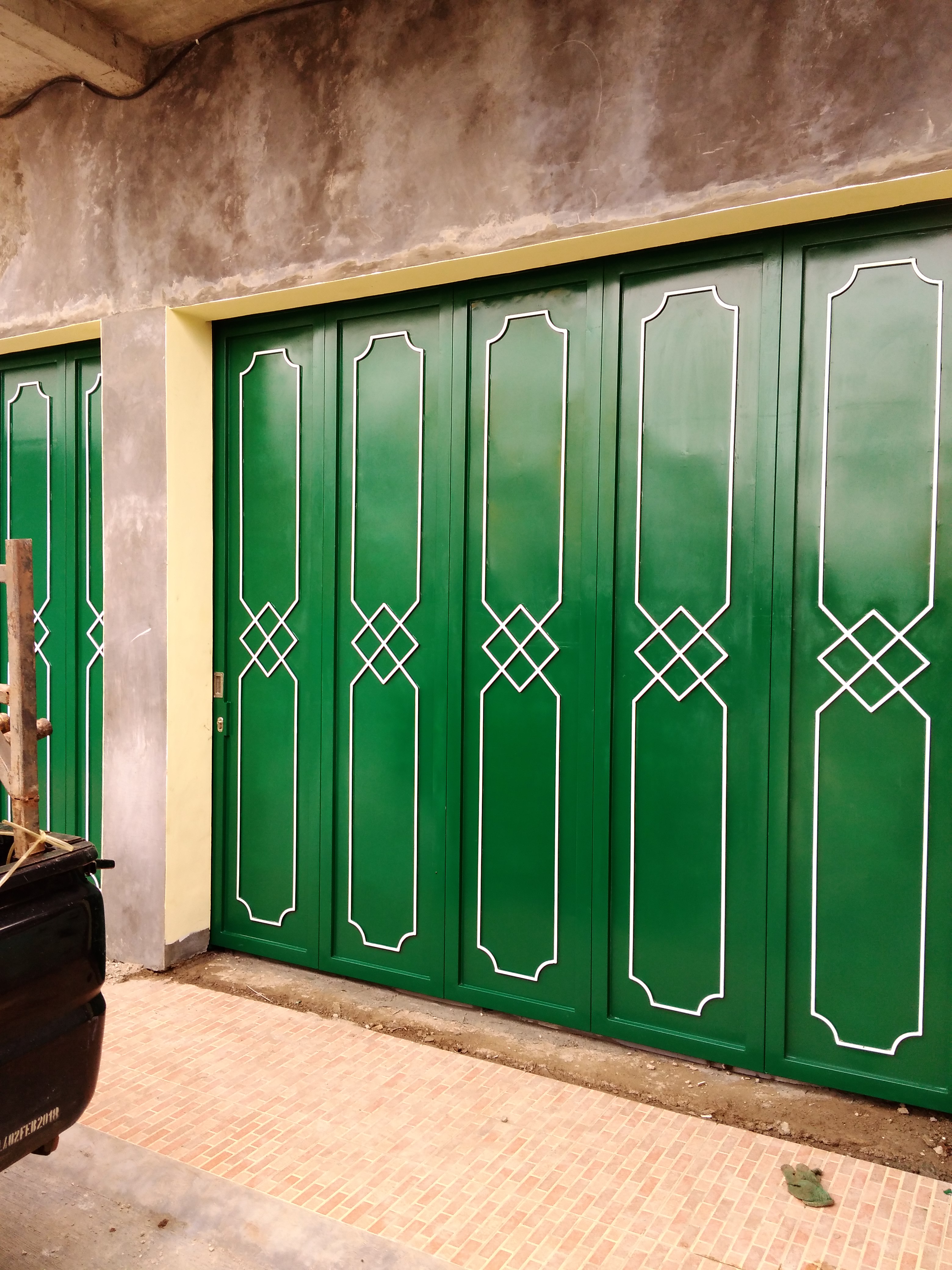 model pintu  garasi besi  geser  I Bengkellas